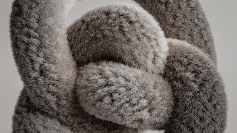 A close up of a stuffed animal on a white surface