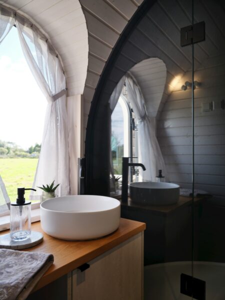 A bathroom with a sink and a large window