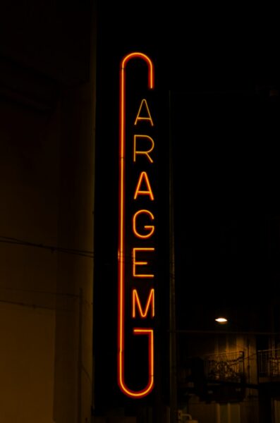a sign that is lit up in the dark
