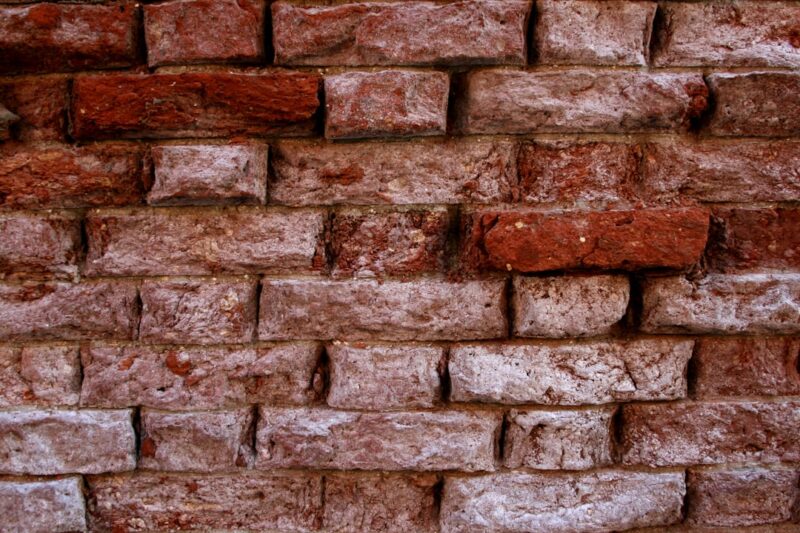 A close up of a brick wall made of bricks.