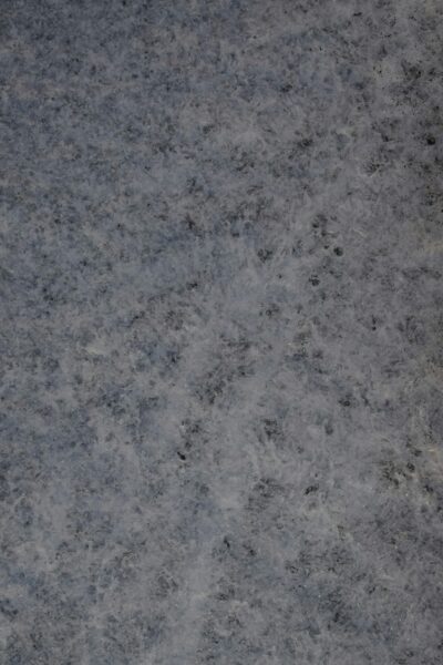A detailed close-up of a textured marble surface with a natural pattern.