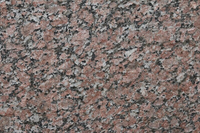 Brown and black concrete floor with marble texture.