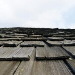Close-up roof shingles for impact resistant shingle guide