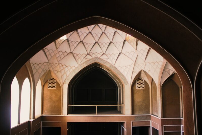 A view of a building through an arch