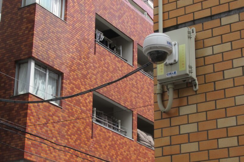 Security camera mounted on a building's exterior.