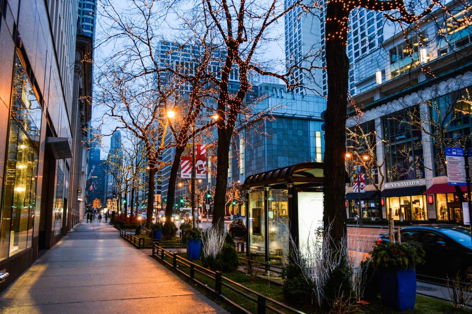 Evening street lighting adds visibility and atmosphere along a busy urban corridor.