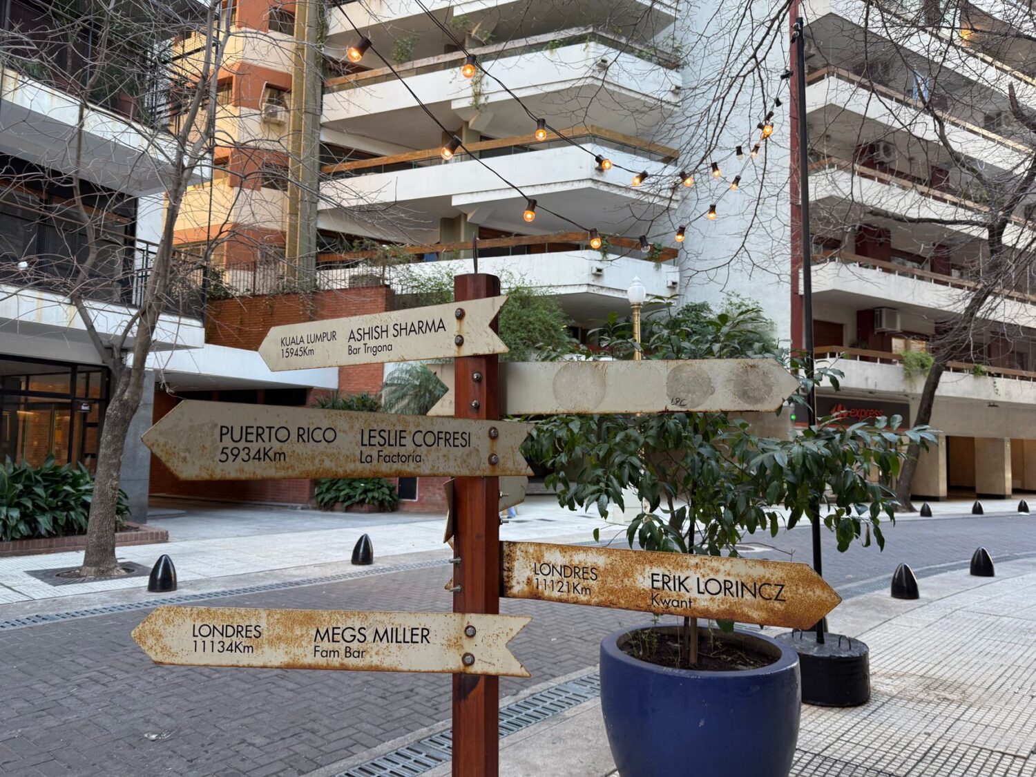 Directional street signs show how wayfinding gives people orientation in dense urban districts.