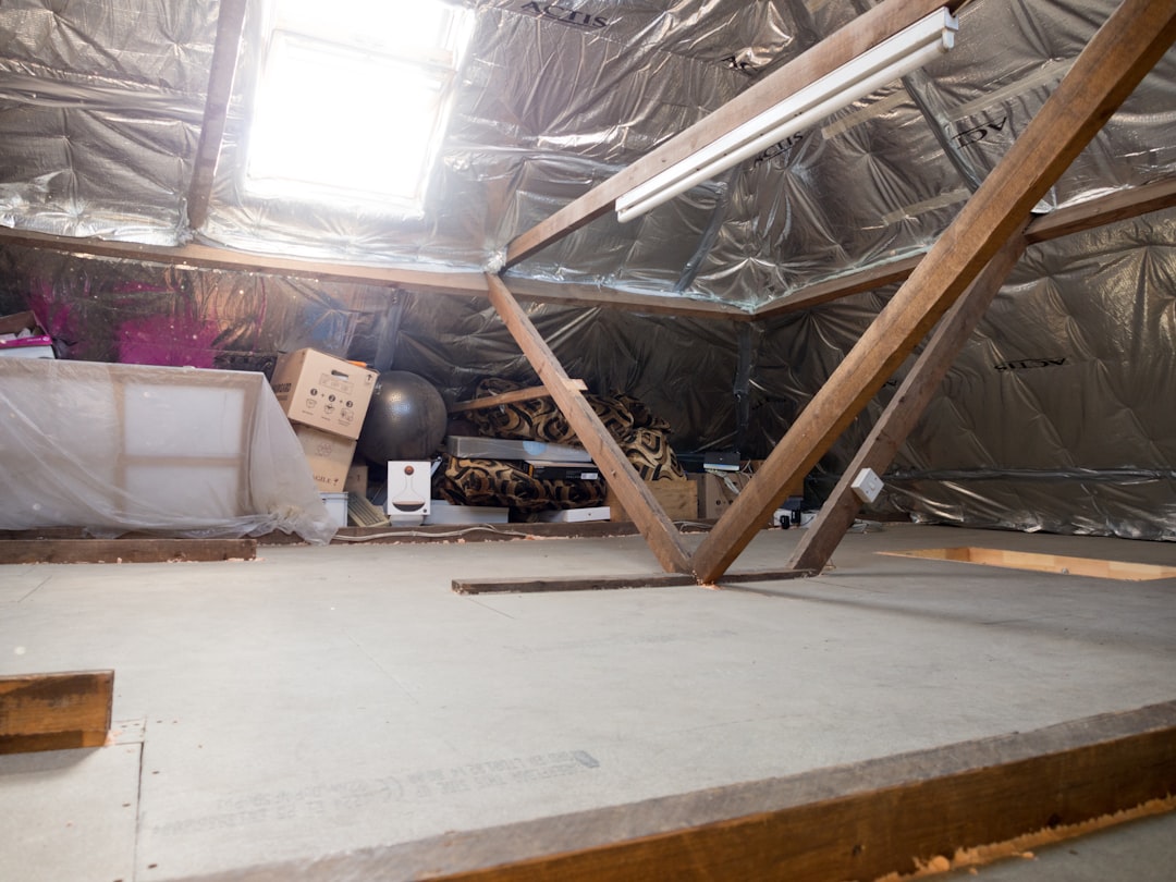 An attic with some stored items is pictured.