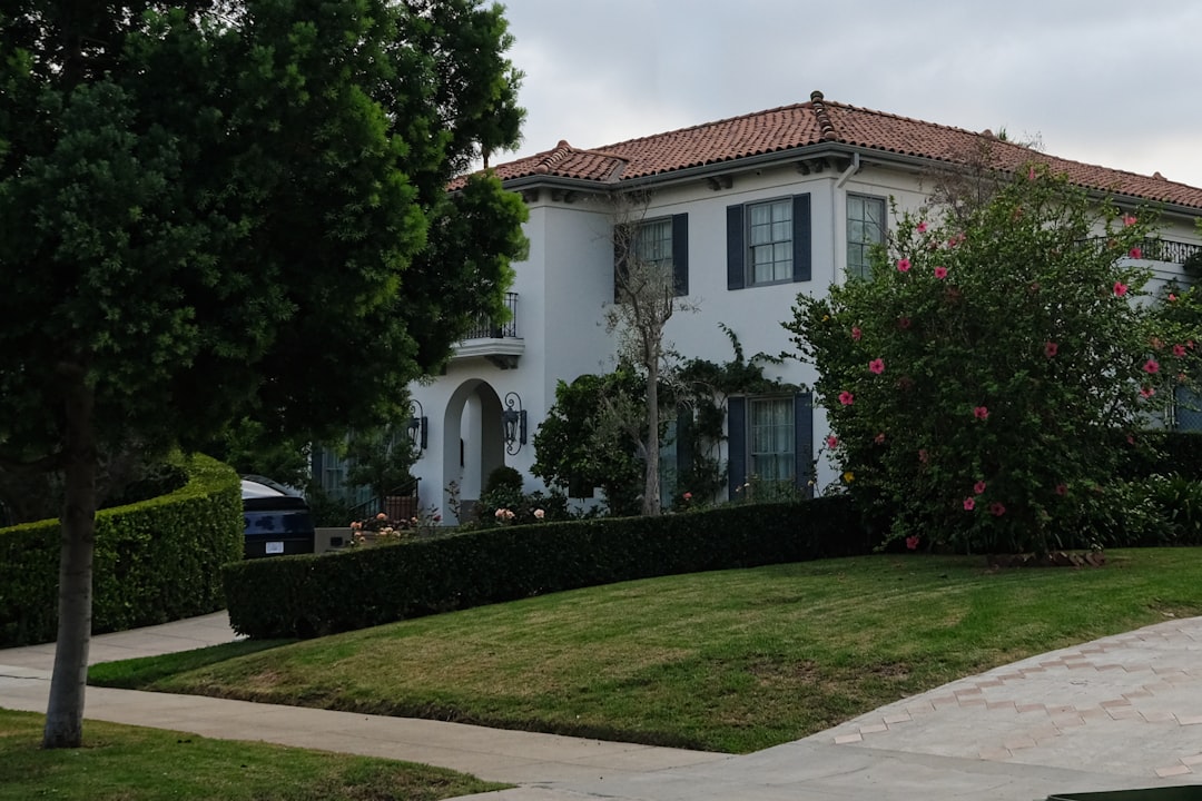 A large white house with a tiled roof.