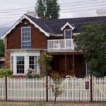 Residential house exterior, facade, yard, driveway, roof, siding, or curb appeal scene.