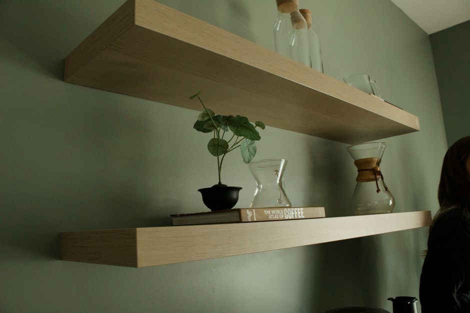 kitchen wall shelves holding dishes and decor