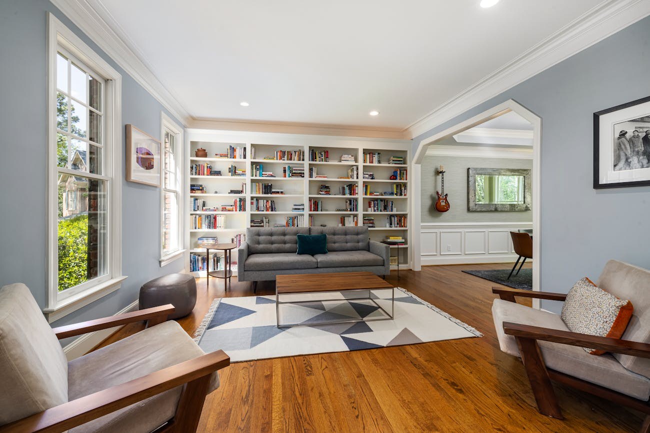 Large bookshelf in a modern living room with seating