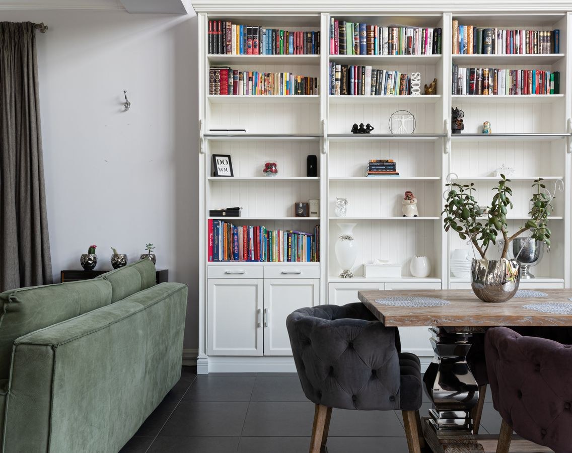 Modern living room with bookcase and layered decor