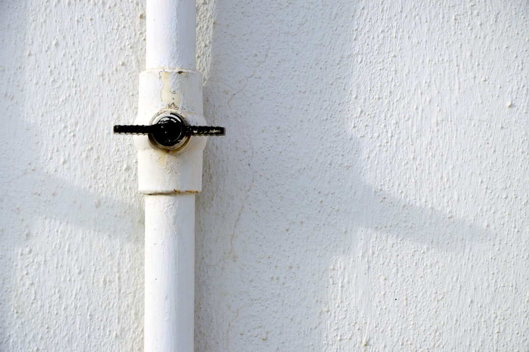 black and white pipe on white wall