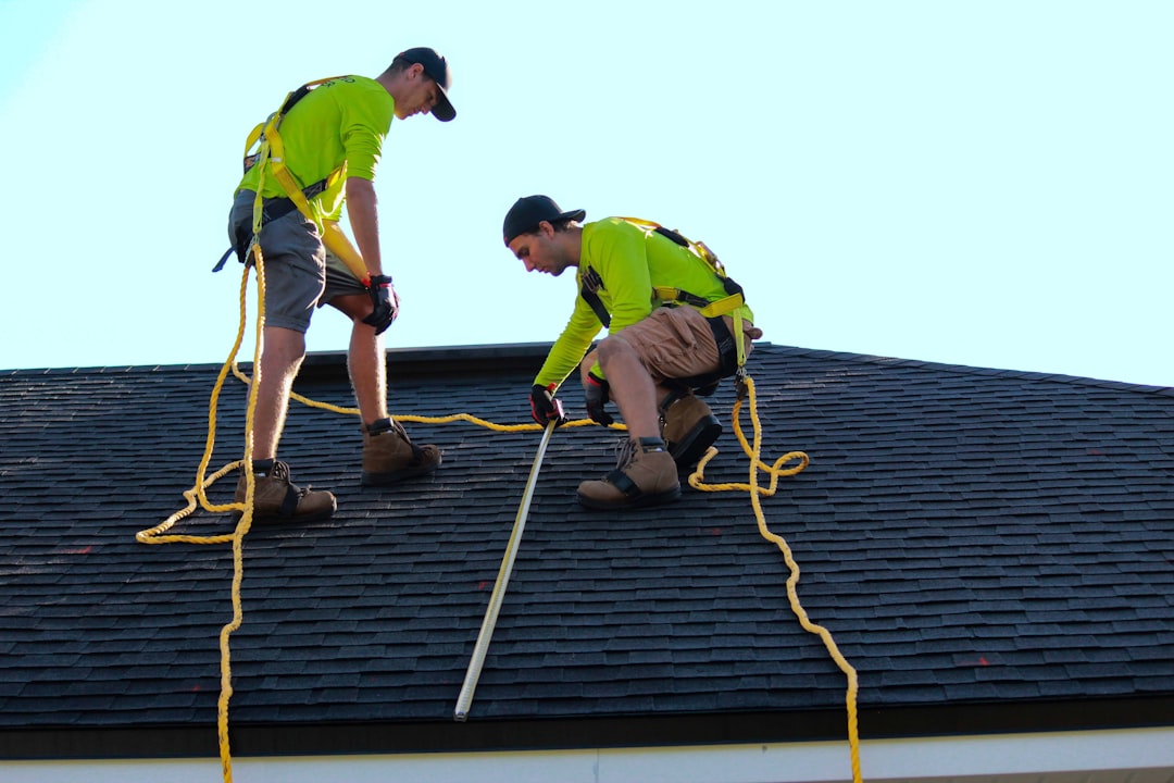 Roof replacement work in progress on a pitched home roof