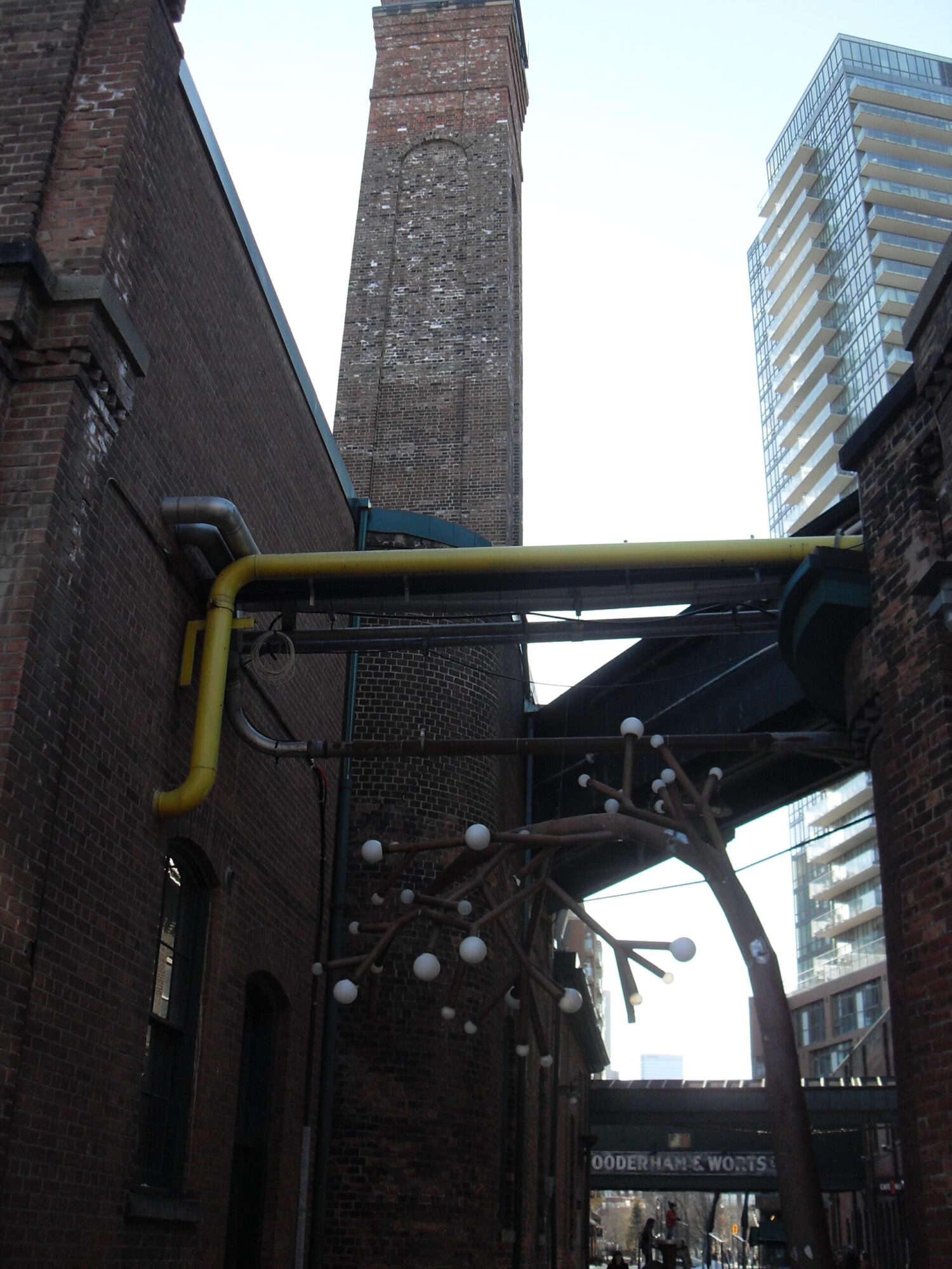 Toronto’s Distillery District transforms Victorian whiskey factory buildings into a vibrant pedestrian arts and retail heritage district.
