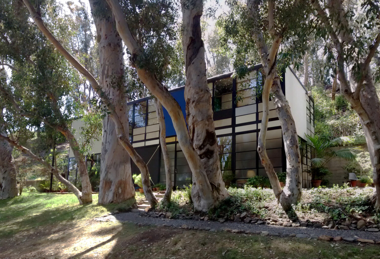The Eames House’s modular steel and glass design nestled in California hills.