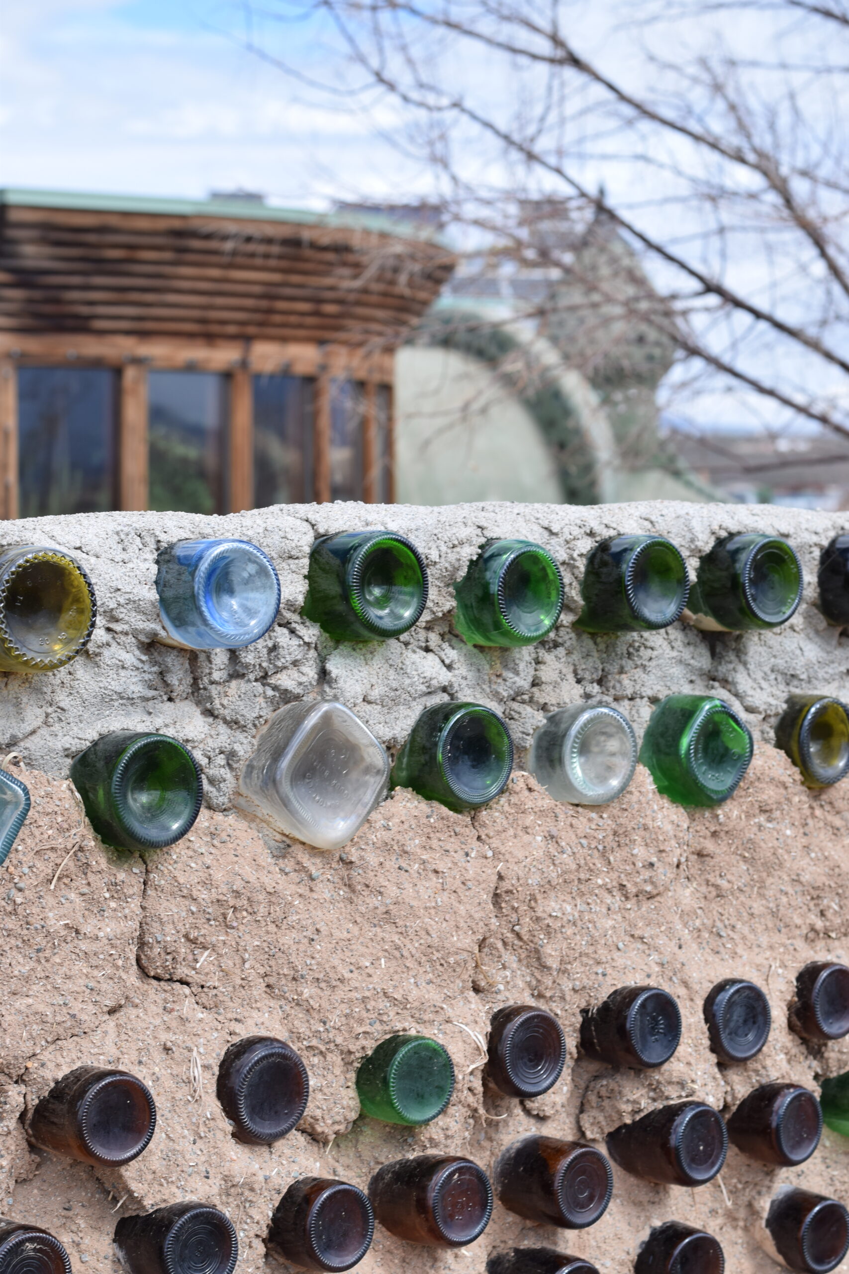 Earthship Biotecture home interior with recycled materials and passive solar design in Taos, New Mexico.