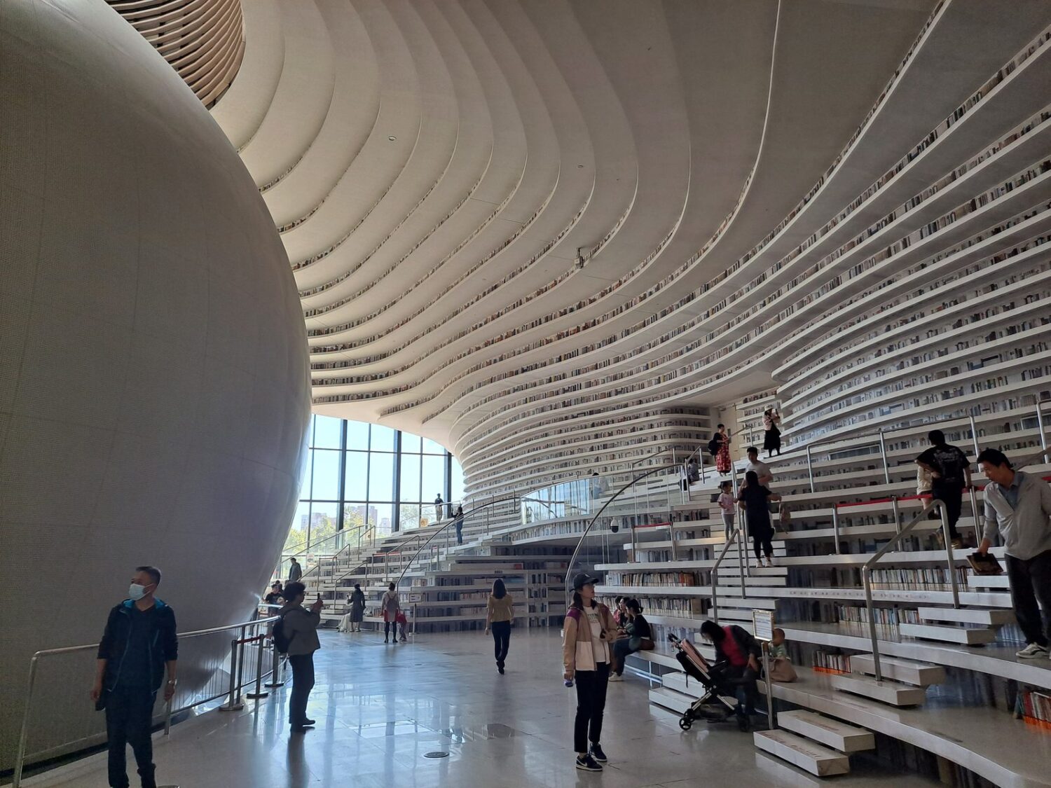 Tianjin Binhai Library, Tianjin, China, distinguished by its futuristic spherical auditorium and flowing bookshelves.