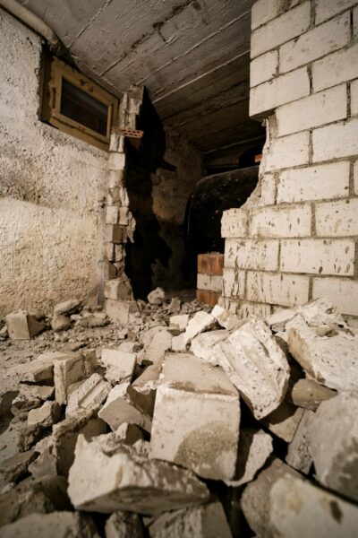 Breaking walls to get rid of an old oil tank.