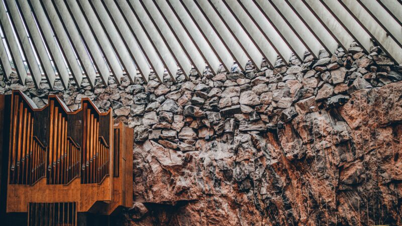 Captivating interior of the Temppeliaukio Church showcasing its unique architecture and rock walls.