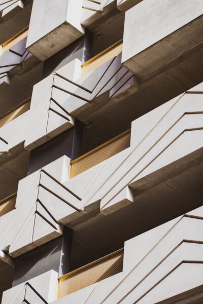 Close-up view of a contemporary building with geometric patterns and concrete facade.